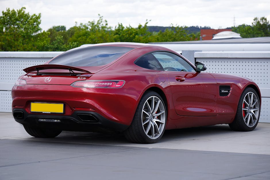 Red Mercedes Benz sports car shown parked with clear tail lights and modern design